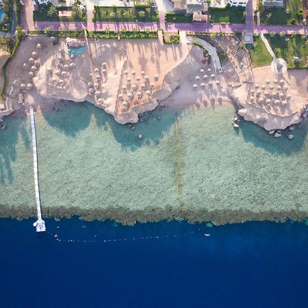 Safir Sharm Waterfalls Resort Exterior foto Aerial view of the beach